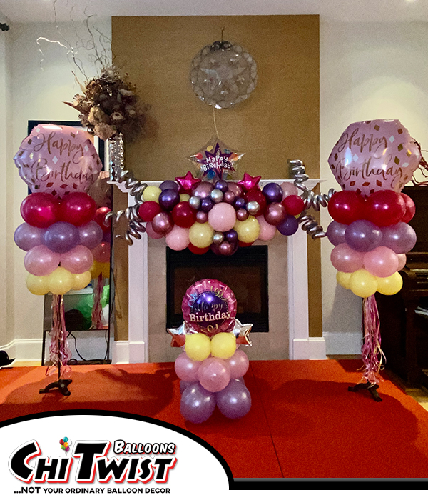 Fun Indoor Balloon Dispay in pinks, purples and yellow