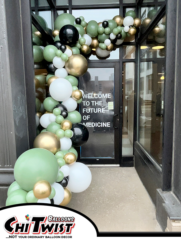 green white black and gold balloon demi arch