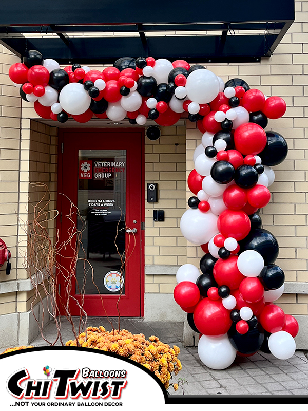 red white black garland arch